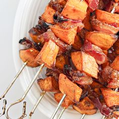 the skewers are being used to make sweet potatoes and bacon on skewers