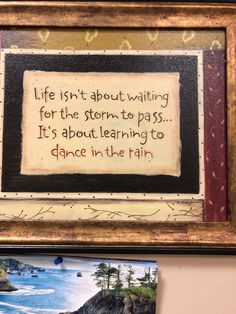 a painting on the wall with a quote above it that reads, life isn't about waiting for the storm to pass