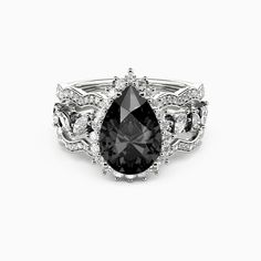 a black and white diamond ring with diamonds on it's sides, set in 18k white gold