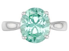 3.42ct oval lab created green spinel, rhodium over sterling silver solitaire ring. Measures approximately .40"L x .42"W. Not sizeable. Finished under gallery. Oval Platinum Gemstone With Center Stone, Oval Emerald Ring With Prong Setting In Platinum, Oval Platinum Emerald Ring With Prong Setting, Oval Emerald Ring In Platinum, Platinum Emerald Ring With Accent Stones, Oval Emerald Ring With Accent Stones In Platinum, Green Platinum Rings With Accent Stones, Oval Diamond Cut Emerald Ring In Fine Jewelry Style, Oval Emerald Ring With Diamond Cut In Platinum