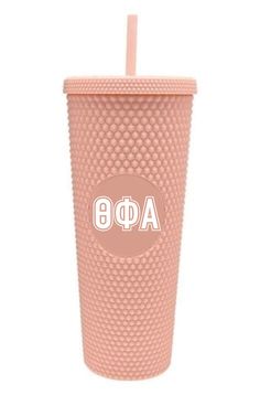 a pink tumbler cup with the word ap8 on it and a straw in front