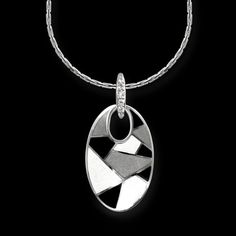 From work to evening wear this Black and white enamel pendant in sterling silver and set with white sapphires makes a stunning statement! White Gold Pendant Necklace With Black Enamel, Modern Silver Necklace With Black Enamel, Sterling Silver Necklace With Black Enamel, Elegant Enamel Necklaces With Polished Finish, Silver Enamel Oval Pendant Necklace, Silver Enamel Necklace With Oval Pendant, Silver Enamel Oval Pendant Necklaces, Silver Enamel Necklaces With Oval Pendant, Modern Silver Enamel Necklace