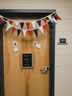 a door decorated with red, white and blue bunting