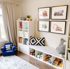 a child's room with toys, bookshelves and pictures on the wall