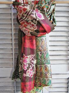 Large, gorgeous silk scarf. The word dupatta means "shawl of doubled cloth". One side of this scarf is red and pink batik and the other side is mainly green paisley. 100% silk, with a running kantha stitch throughout, and fringed ends. As well a a scarf, this is large enough to cover a small table, arrange as a faux headboard, decorate a window...very versatile!82" long and 34" wide Gift boxed. This is a fair trade item from Jaipur, India. >More from Artisans of the World Faux Headboard, Mint Jewelry, Green Paisley, Kantha Stitch, Small Table, Jaipur India, Birthday Gift Ideas, Vintage Gifts, The Other Side