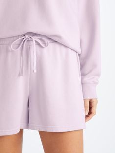 Seen here in lilac, our Quinn sweat shorts ensure all-day-long comfort. Featuring a combined elastic and tie waistband, our sweats also feature two front side pockets and a zipped back pocket to keep your phone and essentials close whilst you're out and about. Stylish, yet practical. The Quinn fabric combines all the key qualities of our cotton and micro modal; it's durable and has great colour retention, meaning it can withstand long-lasting wear and won't fade in colour. It's thermoregulating, Sporty Shorts For Spring Relaxation, Sporty Spring Shorts For Relaxation, Spring Athleisure Shorts For Relaxation, Spring Lounging Shorts With Drawstring, Short Activewear With Functional Drawstring For Loungewear, Drawstring Shorts For Lounging In Spring, Drawstring Shorts For Spring Lounging, Shorts With Functional Drawstring For Loungewear, Short Athleisure Sweatpants For Loungewear