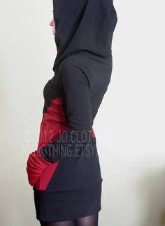 "Hooded tunic dress with extra long scrunch-able sleeves. Black with bright true Red cuffs and side panels. Soft, comfortable cotton spandex jersey. Handmade to order. Please check the shop announcement for my current turnaround time- http://www.etsy.com/shop/joclothing?ref=si_shop Available in sizes X-Small,Small,Medium, Large, X-Large, XX-Large. (please indicate the size you would like or provide your measurements in the 'notes to seller' box at checkout) X-SMALL (0-2) bust 31\"-32\" hips 33\" Hooded Tunic, Extra Long Sleeves, True Red, Tunic Dress, Extra Long, Cotton Spandex, Red Color, Dress Black, Black Red