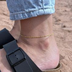 Bare ankles no more. Let this small but mighty anklet take your summer looks to another level. Handcrafted in 14k gold filled, this dainty Satellite Beaded Anklet is perfect for your regular rotation of stackers. From our Capsule Collection which effortlessly fuses simple, easy-to-wear designs with a sophisticated edge. 10% from the sale of this item will be donated to Marine Conservation Society via Work for Good, so you can look great and feel great at the same time! ~ DESIGN ~ Made in 14k gol Adjustable Beaded Chain Anklet As Gift, Ankle Wrap Anklets With Tiny Beads For Gifts, Dainty Adjustable Ankle Wrap Anklets, Dainty Adjustable Beaded Chain Anklets, Minimalist Gold Beaded Anklets, Work For, Anklet Gold, Beaded Ankle Bracelets, Beaded Ankle