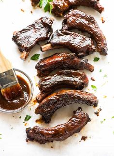 barbecue ribs with bbq sauce and parsley on the side, ready to be grilled