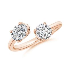 a rose gold ring with two round diamonds