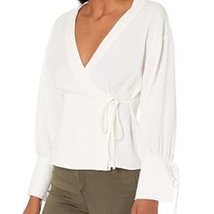 Brand New Lowest Price On Posh Nwt Moon River Ivory Wrap Top With Tie Sleeves Size Medium Features: Ivory Color Blouse V-Neckline Tie Closure 55% Viscose, 29% Polyester, 16% Polyamide Dry Clean Only Size M Approx. Measurements (Laying Flat): Underarm To Underarm - 18.5" Length From Shoulder To Hem - 22" Check Out My Closet For Outfits Perfect For: Beach Beachy Birthday Boho Bohemian Bridal Caftan Chic Christmas Classic Contemporary Coachella Coat Cottagecore Cover Up Coverup Cruise Date Night Dr Versatile White Blouse For Fall, Versatile White Fall Blouse, Beige Long Sleeve Blouse For Brunch, Versatile Fitted White Blouse, Off White V-neck Top For Fall, White Blouse For Fall Daywear, Versatile White Blouse For Work, Feminine Off White Top For Brunch, Versatile Long Sleeve Cream Tops