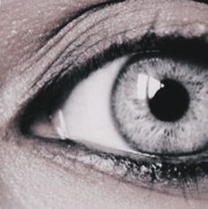 an extreme close up shot of a person's eye with the iris partially open