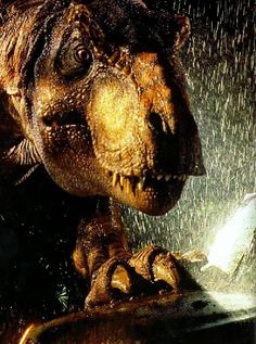 an image of a dinosaur that is in the water with it's mouth open