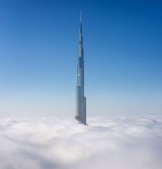 the tallest building in the world is surrounded by clouds