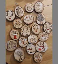 a bunch of wood slices that have been decorated with different designs and shapes on them