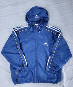 Vintage 1990s Adidas Equipment Blue White Yellow Mesh Lining Light Windbreaker Jacket Small In great condition  Normal wear  Small 26.5 x 25.5 Pit to Pit Any questions feel free to reach out! Adidas Skateboarding Jacket, Cheap Blue Adidas Bags, Cheap Blue Track Jacket For Sports, Cheap Vintage Blue Windbreaker, Adidas 90s Coat, Vintage Blue Adidas Jacket, Adidas Equipment, Adidas Vintage, Line Light