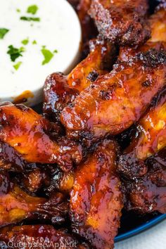 barbecue chicken wings with dipping sauce on the side