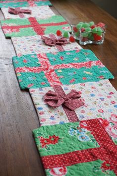 the table runner is decorated with red and green fabric