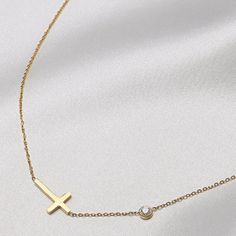 Embrace timeless elegance with our Faith Sideways Cross Necklace. Simple, sophisticated design for any occasion. Fine craftsmanship for a touch of grace in your ensemble. A tasteful and exclusive piece, perfect for expressing your faith and devotion. 16" - 18" cable chain. Ships within 24 hours from Akron, Ohio. Cross Pendant Necklace With Cable Chain As Gift, Elegant Cross Pendant Necklace With Clavicle Chain, Elegant Pendant Cross Necklace With Clavicle Chain, Gift Cross Necklace With Cable Chain, Elegant Cross Charm Necklace With Adjustable Chain, Elegant Necklace With Clavicle Chain And Cross Pendant, Elegant Pendant Cross Necklace With Adjustable Chain, Elegant Yellow Gold Cross Necklace With Delicate Chain, Elegant Charm Necklace With Cross Pendant And Delicate Chain