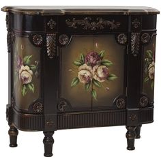 an ornately decorated cabinet with flowers painted on the doors and drawers is shown in this image