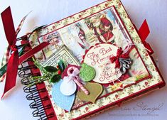 an altered book is decorated with red ribbon