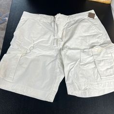 White Cargo Shorts Never Worn. Still Has Tag. White Cargo Shorts With Side Pockets For Spring, White Cargo Shorts For Spring, Spring White Cargo Shorts, White Bermuda Bottoms With Pockets, Casual White Cargo Shorts, White Cotton Cargo Shorts With Built-in Shorts, White Cargo Shorts With Pockets, White Cargo Shorts With Built-in Shorts, White Cotton Cargo Shorts With Pockets