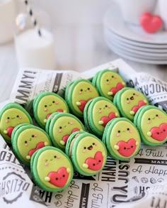 there are many decorated cookies on the plate