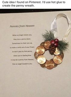 a christmas ornament with coins and pineconis on it's side