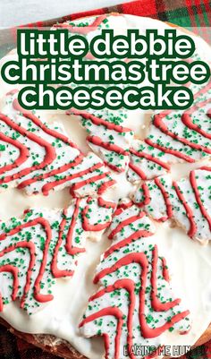 a close up of a cake with white frosting and green sprinkles