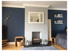 a living room with blue walls and furniture