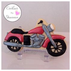 a cookie shaped like a motorcycle is on display