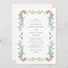 a wedding card with flowers and vines on the front, in blue and pink colors