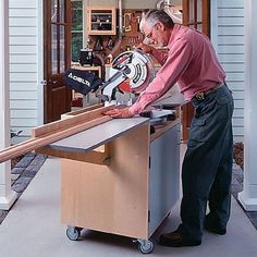 an older man working on a piece of wood with a circular sawhorse in front of him