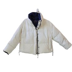 Nwt Sweaty Betty Navy Blue/Ivory(Winter White) Reversible Jacket. Size L. 550 Fill Power. Reversible. Side Zip Vent Detail. Pockets. Front 2 Way Zip & Snap Button Closure. Main: 100% Polyester. Body Lining: 100% Polyamide. Pocket Lining: 93% Polyester 7% Elastane. 100% Recycled Duck Down. Approx. Measurements: Refer To Pictures. Flaws: Small Spot(S) On White Side Of Jacket Shown. Also Throughout; You Can Can See The Feather Material On The White Side(An Example Shown) Nr239 White Padded Collar Outerwear For Fall, White Outerwear With Padded Collar For Cold Weather, White Padded Collar Outerwear For Cold Weather, White Outerwear With Padded Collar For Work, White Padded Collar Outerwear For Work, White Puffer Jacket With Padded Collar For Cold Weather, White Puffer Jacket With Padded Collar For Outdoor, Functional Fleece-lined Winter Track Jacket, Spring Nylon Track Jacket With Double-lined Hood