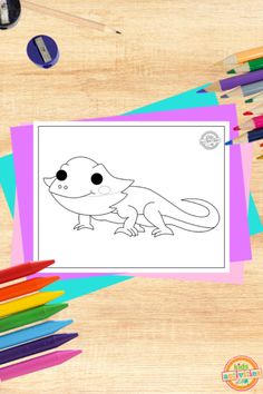 an animal coloring book with colored pencils and crayons