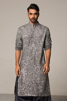 Ombre pewter and gunmetal straight kurta with all-over hand sequin work. Comes with organza charcoal patiala pants.
Component: 2
Embroidered
Neckline: Mandarin Collar
Sleeve Length: Long
Fabric: Kurta: Georgette; Pant: Organza
Color: Grey
Concealed placket
Side slits - Aza Fashions Indo Western Outfits For Men, Grey Kurta, Wedding Kurta For Men, Black Outfit Men, Men's Wedding Outfit, Gents Kurta, Kurta Set For Men, Kurta Men, Men Kurta