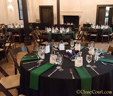 the tables are set with place settings for guests to sit down and have their name tags on them