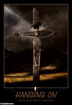 a wooden crucifix with the words hanging on it in front of a dark sky