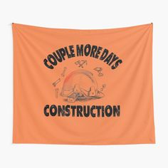 an orange wall tapestry with the words couple more days construction