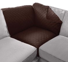 a white and brown couch sitting next to each other