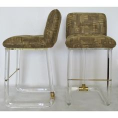 pair of modern bar stools in clear acrylic with woven upholster