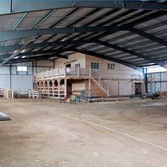 the inside of a warehouse with pallets and other items