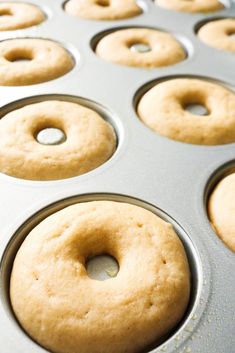 a muffin pan filled with freshly baked donuts