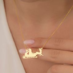 "14K Gold Santa Claus Snowman Xmas Tree and Bell Necklaces ( Dainty Christmas Jewelry ) is lightweight and shine in the light. This necklace is a perfect gift for a mom, a sister, or your wife on Christmas , birthday, anniversary. Materials: 925K Sterling Silver Charm Size: Height 23 mm - Width 15 mm(Snowman) Height 20 mm - Width 14 mm(Bell) Height 15 mm - Width 33 mm (Santa) Height 20 mm - Width 15 mm (Tree) Style: Minimalist Chain style: Cable Chain length: from \"12 (+2\" Extender) to \"22 (+ Personalized Christmas Jewelry For Holidays, Personalized Christmas Holiday Jewelry, Gold Necklace For Festive Christmas Occasion, Hallmarked Jewelry For Personalized Christmas Gift, Gold Necklace For Christmas Gift, Christmas Gift Jewelry With Hallmark, Gold Necklace For Christmas Personalized Gift, Personalized Gold Necklace For Christmas, Personalized Christmas Gift Necklaces