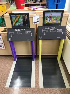 two video game machines sitting on top of a floor