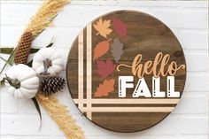 a wooden sign that says hello fall on it