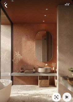 an image of a bathroom setting with orange and pink colors on the walls, sink and mirror