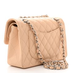 This is an authentic CHANEL Lambskin Quilted Small Double Flap in Beige. This classic shoulder bag is crafted of diamond quilted lambskin leather in light beige. The bag features a silver chain-link shoulder strap threaded with leather and gold Chanel CC turn-lock for the facing flap. This opens to reveal an inner flap and patch pockets. Chanel Double Flap, Chanel Crossbody, Chanel Tweed, Chanel Flap Bag, Denim Quilt, Gold Chanel, Chanel Shoulder Bag, Heart Bag, Diamond Quilt