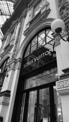 black and white photograph of louis vuittoty storefront in new york city