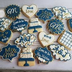 many decorated cookies are arranged on a table